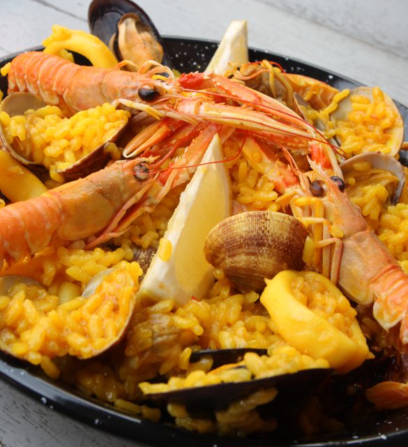 Spanish tradicional paella home-made composed of rice, and  fresh seafood like clams, king prawns and squid rings.