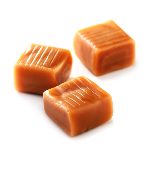 caramel candy  close-up on white background