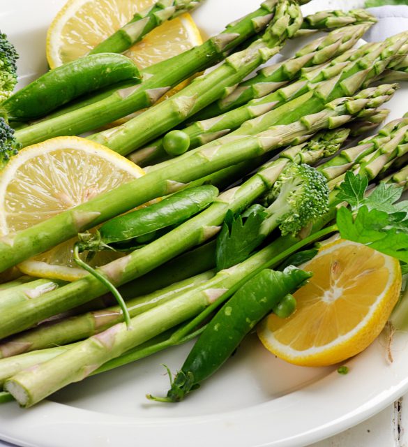 Green asparagus on a white plate.