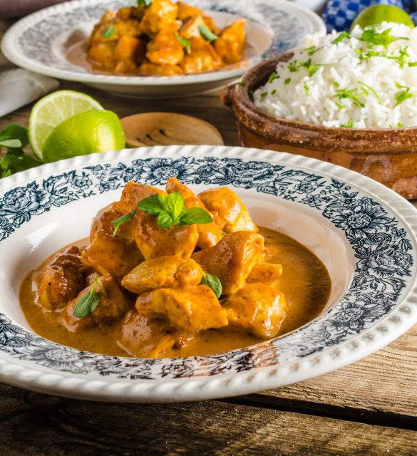 Curry chicken with basmati rice, delicious and spicy food, fresh herbs, very simple to make